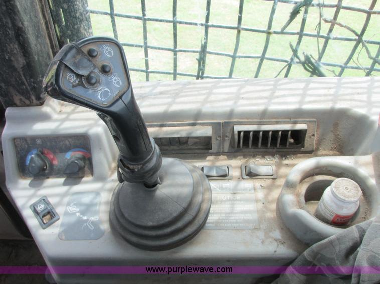 image for item J2500 2002 Caterpillar 525B grapple skidder