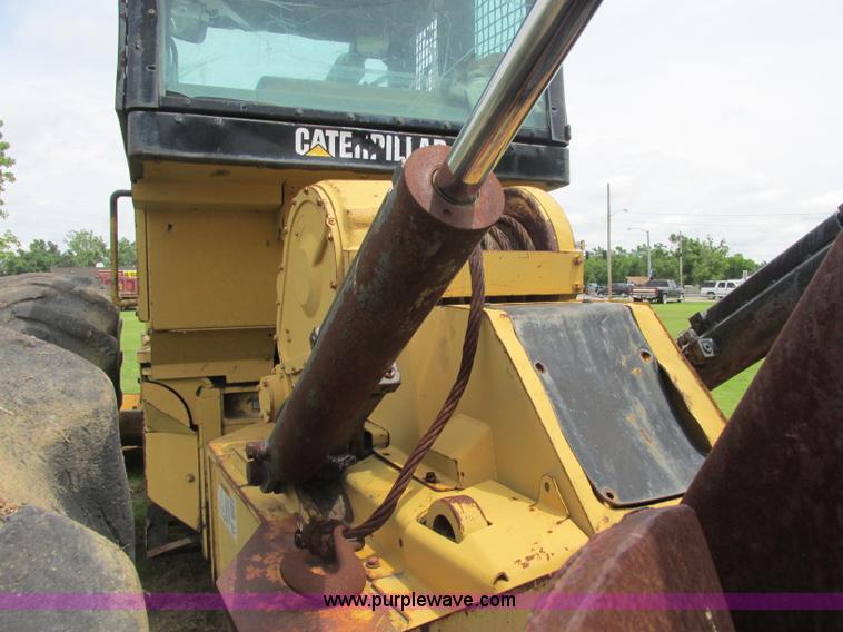 image for item J2500 2002 Caterpillar 525B grapple skidder