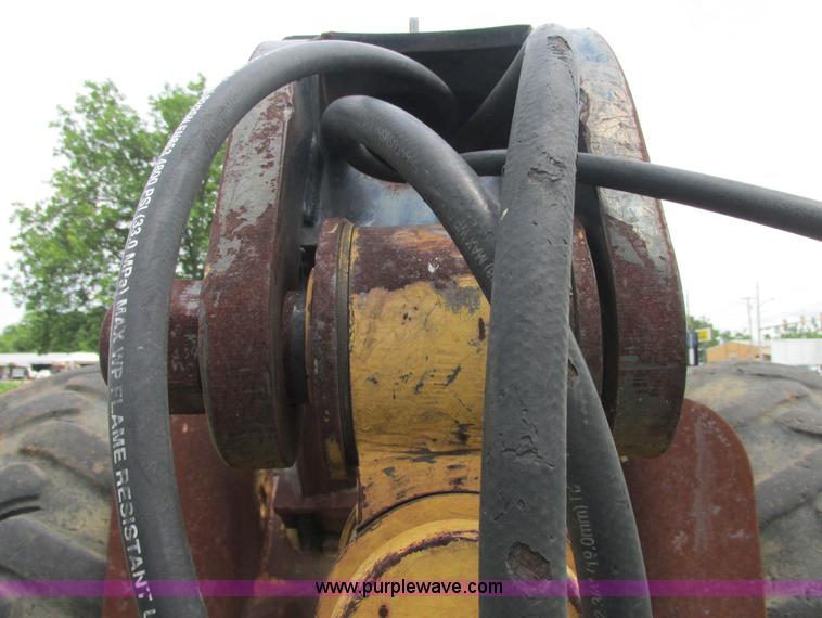 image for item J2500 2002 Caterpillar 525B grapple skidder