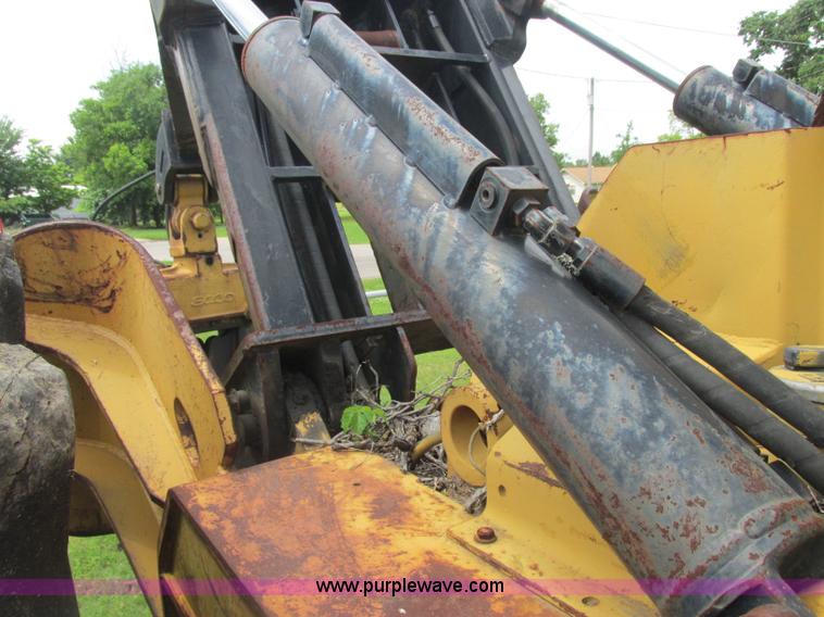 image for item J2500 2002 Caterpillar 525B grapple skidder