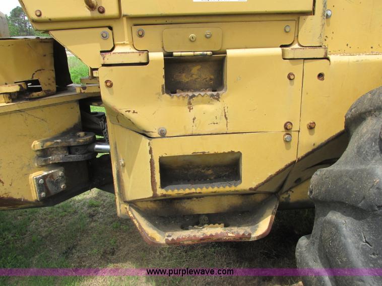 image for item J2500 2002 Caterpillar 525B grapple skidder