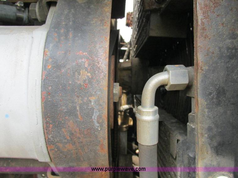 image for item J2500 2002 Caterpillar 525B grapple skidder