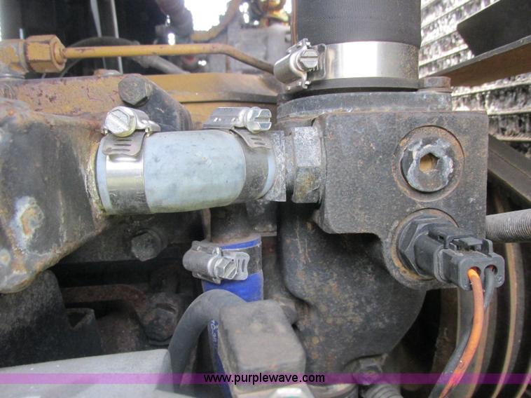 image for item J2500 2002 Caterpillar 525B grapple skidder