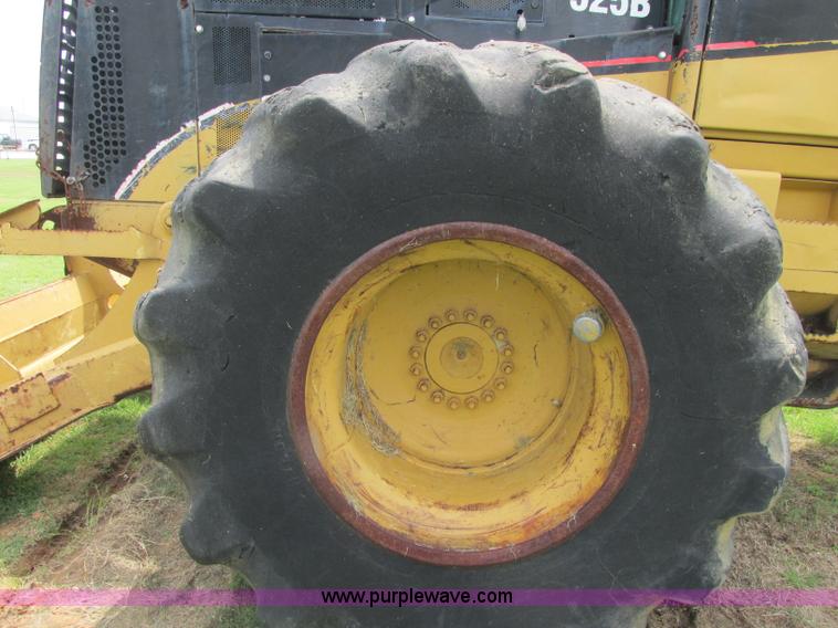 image for item J2500 2002 Caterpillar 525B grapple skidder