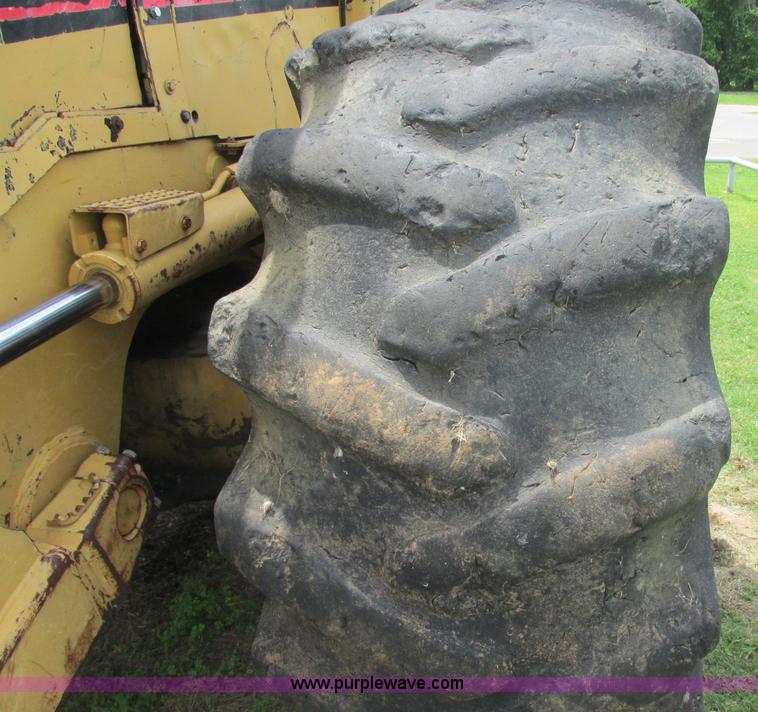 image for item J2500 2002 Caterpillar 525B grapple skidder