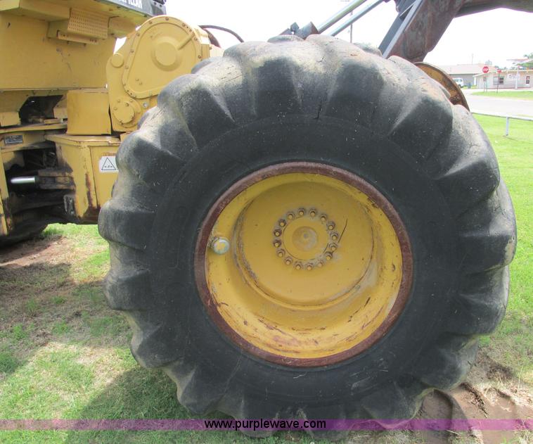 image for item J2500 2002 Caterpillar 525B grapple skidder