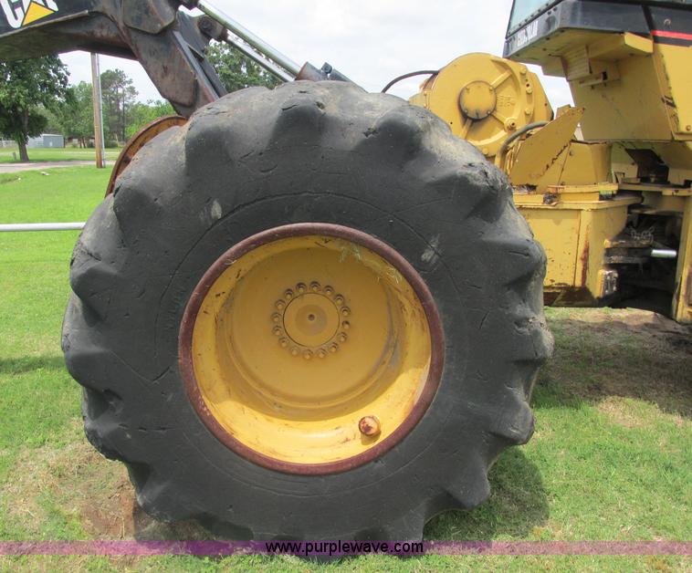 image for item J2500 2002 Caterpillar 525B grapple skidder