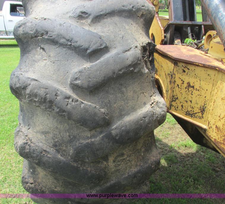 image for item J2500 2002 Caterpillar 525B grapple skidder