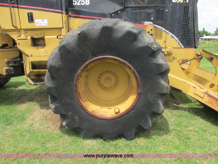 image for item J2500 2002 Caterpillar 525B grapple skidder