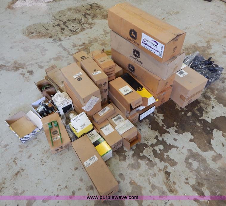 Assorted John Deere air, hydrauilc, oil, and fuel filters and parts in ...