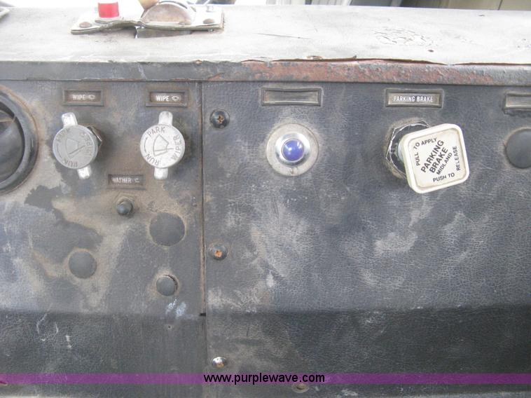 image for item H5424 1984 Mack MR686S roll-off truck