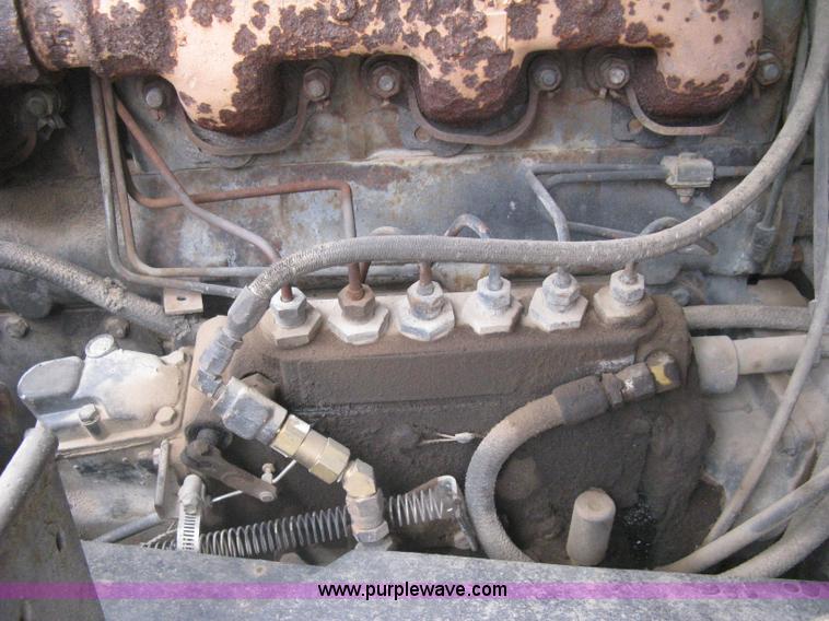 image for item H5424 1984 Mack MR686S roll-off truck