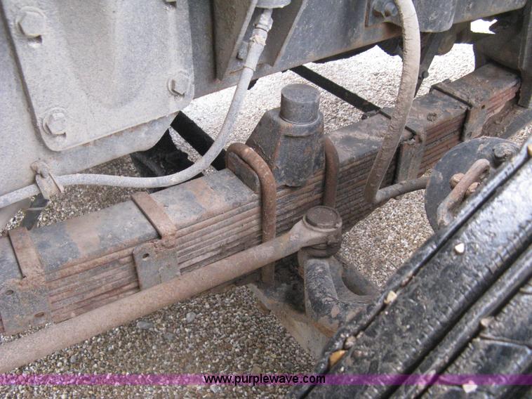 image for item H5424 1984 Mack MR686S roll-off truck