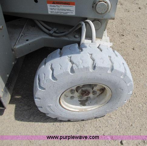 image for item F4952 1999 Mec 2548 HT electric scissor lift