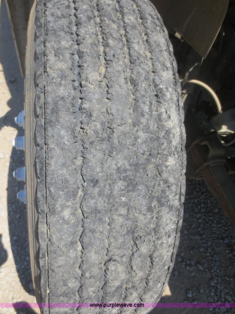 image for item F8291 1998 International 4700 chip bed truck