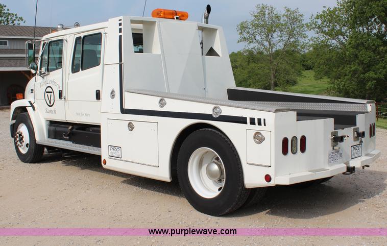 image for item H2715 2002 Freightliner FL70 Crew Cab flatbed truck