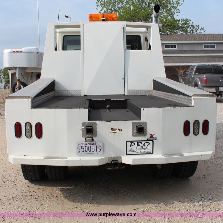 image for item H2715 2002 Freightliner FL70 Crew Cab flatbed truck