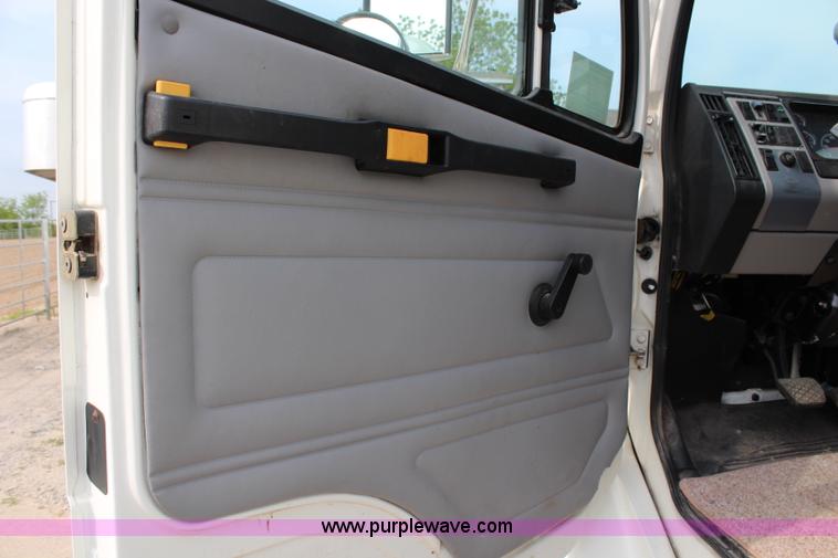 image for item H2715 2002 Freightliner FL70 Crew Cab flatbed truck