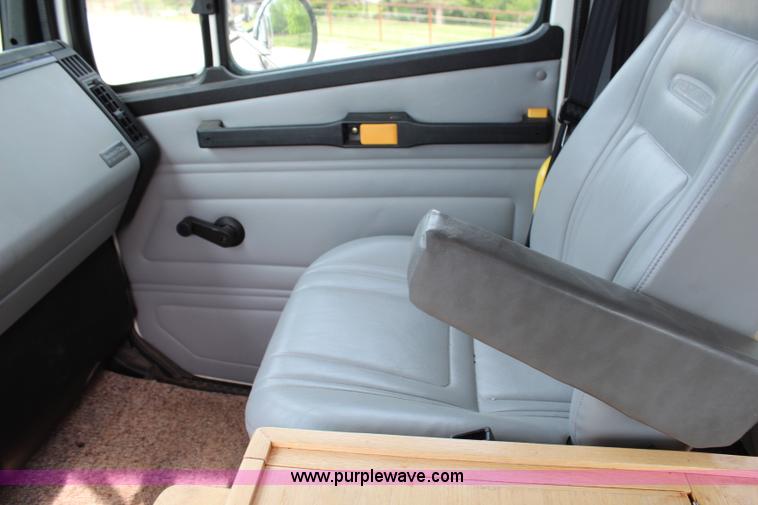 image for item H2715 2002 Freightliner FL70 Crew Cab flatbed truck