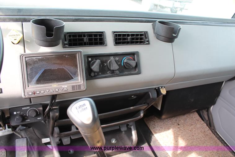 image for item H2715 2002 Freightliner FL70 Crew Cab flatbed truck