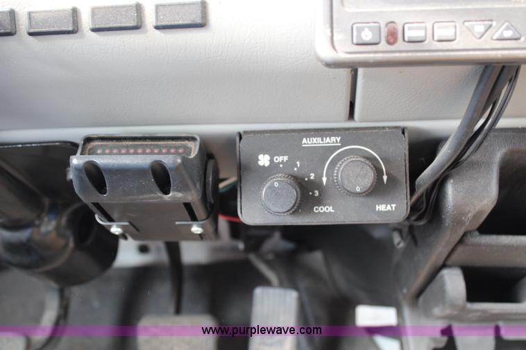 image for item H2715 2002 Freightliner FL70 Crew Cab flatbed truck