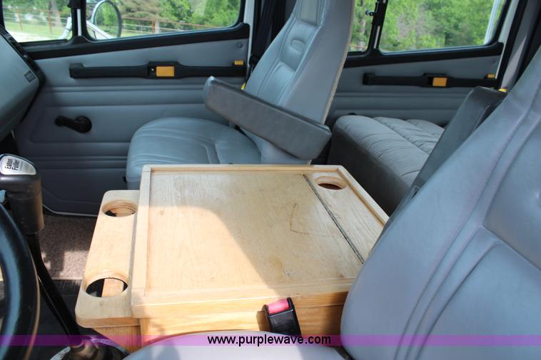 image for item H2715 2002 Freightliner FL70 Crew Cab flatbed truck