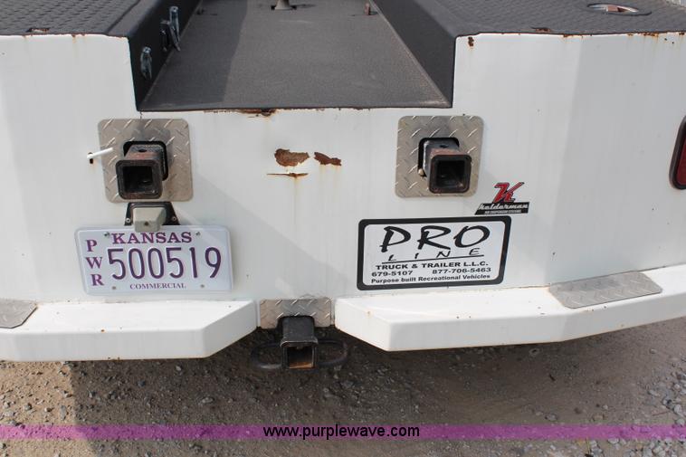 image for item H2715 2002 Freightliner FL70 Crew Cab flatbed truck