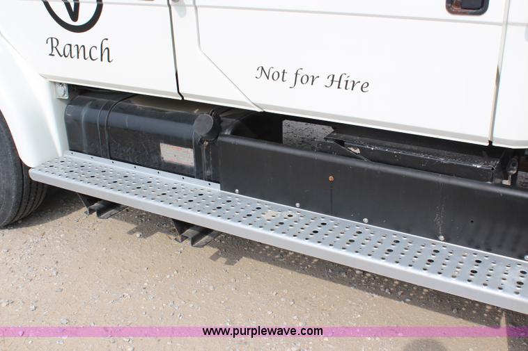 image for item H2715 2002 Freightliner FL70 Crew Cab flatbed truck