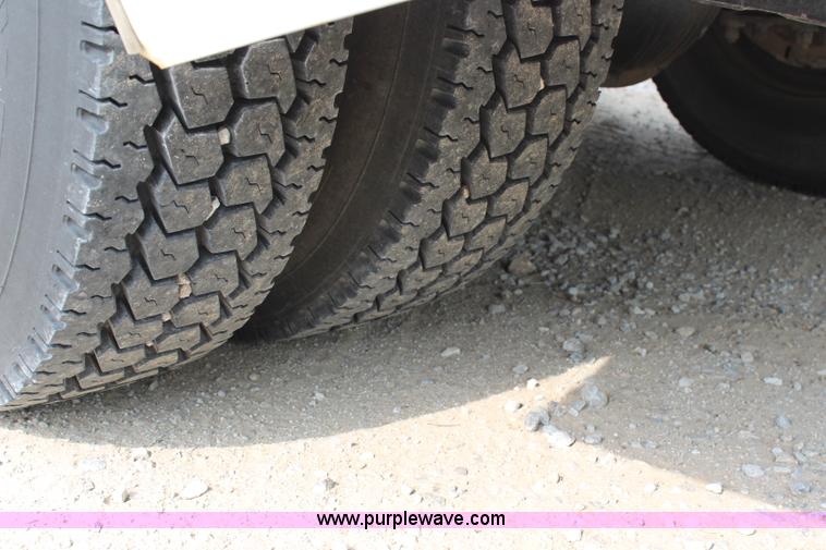 image for item H2715 2002 Freightliner FL70 Crew Cab flatbed truck