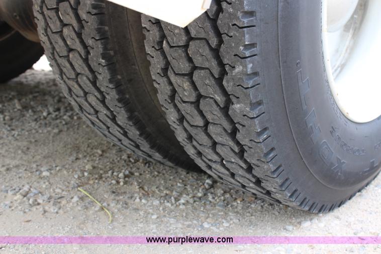 image for item H2715 2002 Freightliner FL70 Crew Cab flatbed truck