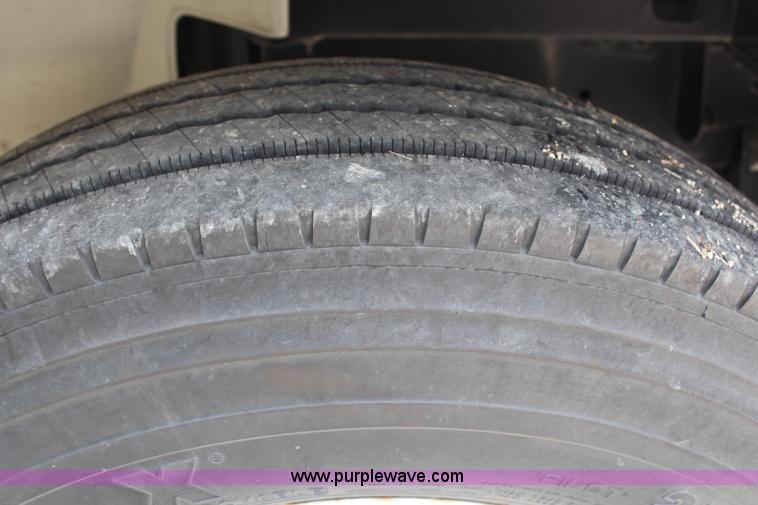 image for item H2715 2002 Freightliner FL70 Crew Cab flatbed truck