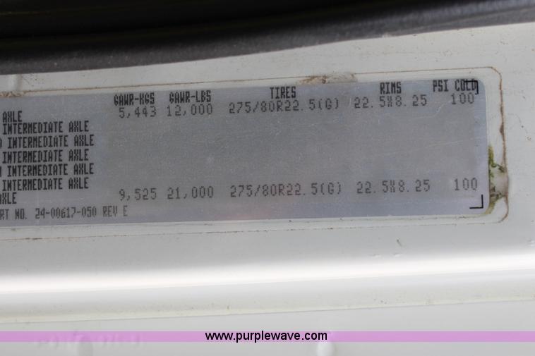 image for item H2715 2002 Freightliner FL70 Crew Cab flatbed truck