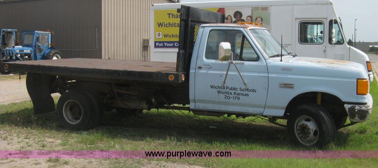 image for item H5377 1989 Ford F450 Super Duty flatbed pickup truck