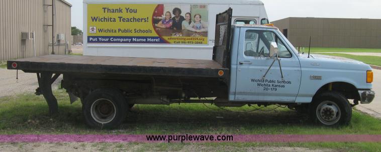 image for item H5377 1989 Ford F450 Super Duty flatbed pickup truck