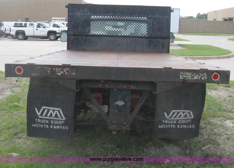 image for item H5377 1989 Ford F450 Super Duty flatbed pickup truck