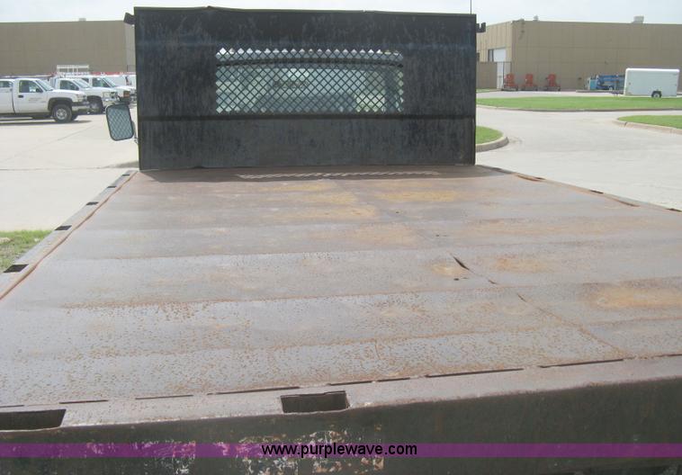 image for item H5377 1989 Ford F450 Super Duty flatbed pickup truck