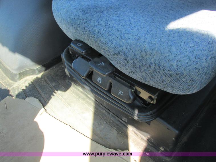 image for item A8729 2006 New Holland TG275 MFWD tractor