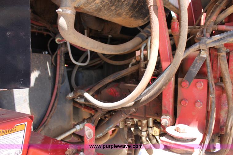 image for item C3892 2006 New Holland HW365 self-propelled windrower