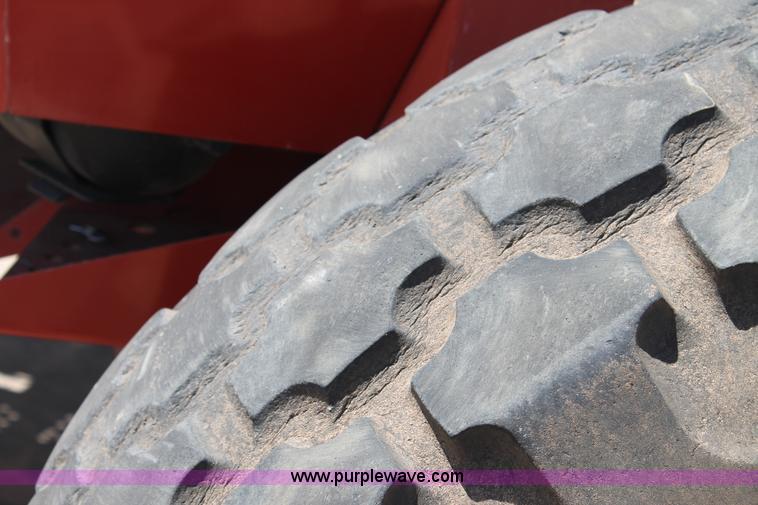 image for item C3892 2006 New Holland HW365 self-propelled windrower