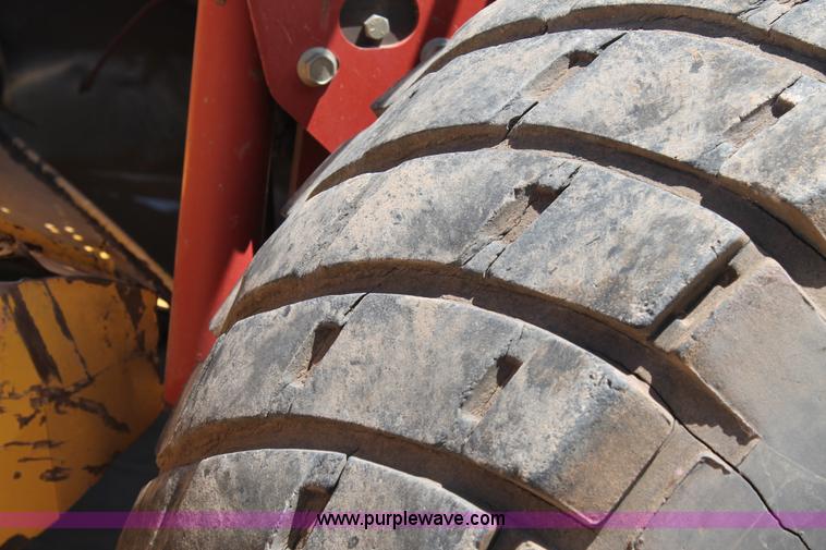 image for item C3892 2006 New Holland HW365 self-propelled windrower