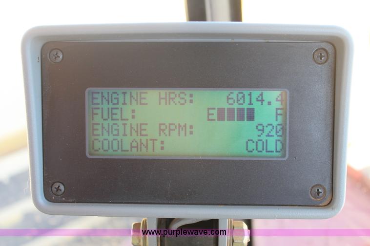 image for item C3892 2006 New Holland HW365 self-propelled windrower