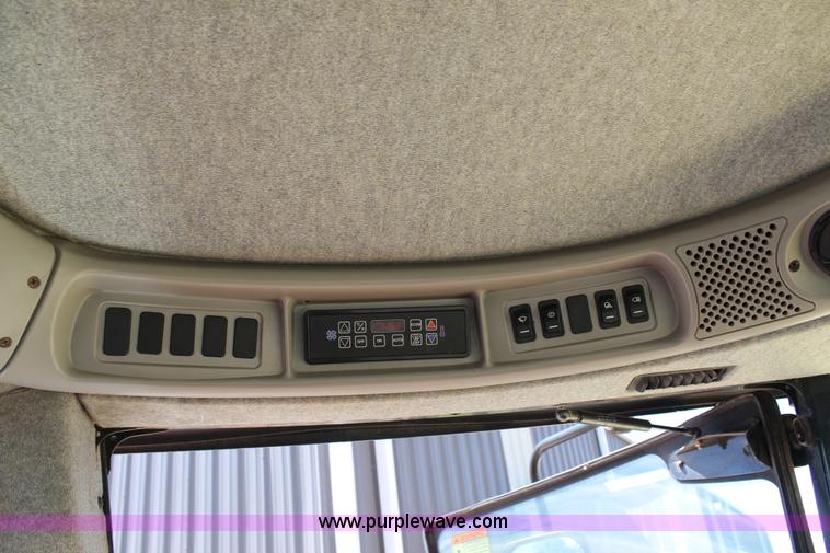 image for item C3892 2006 New Holland HW365 self-propelled windrower