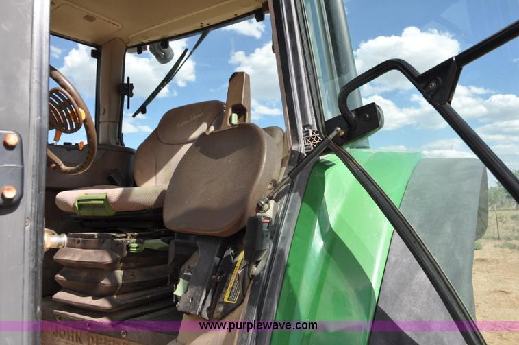 image for item F2024 2003 John Deere 7520 MFWD tractor