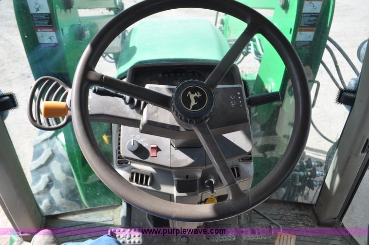 image for item F2024 2003 John Deere 7520 MFWD tractor