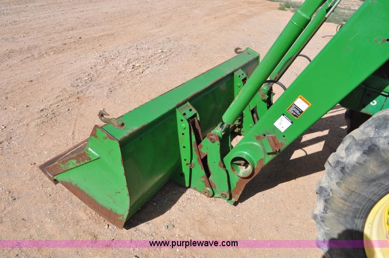 image for item F2024 2003 John Deere 7520 MFWD tractor