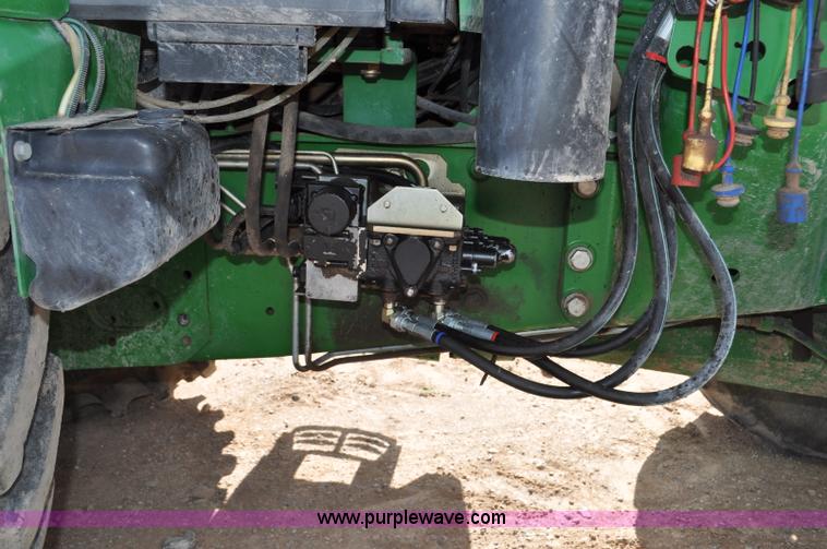 image for item F2024 2003 John Deere 7520 MFWD tractor