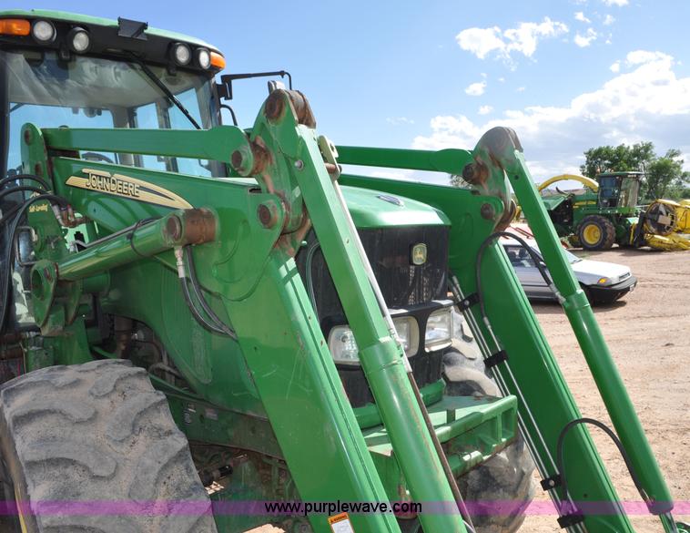 image for item F2024 2003 John Deere 7520 MFWD tractor