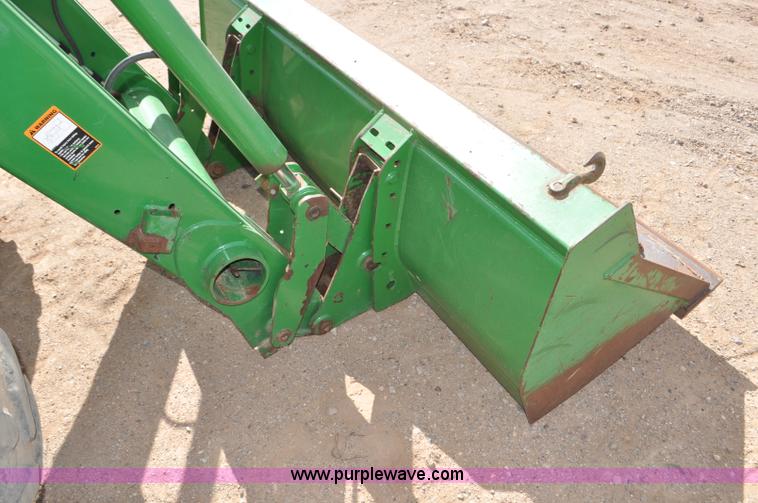 image for item F2024 2003 John Deere 7520 MFWD tractor