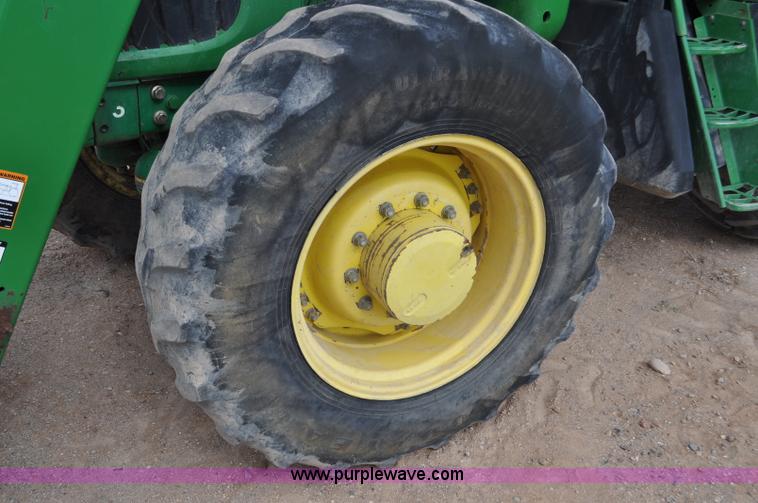 image for item F2024 2003 John Deere 7520 MFWD tractor