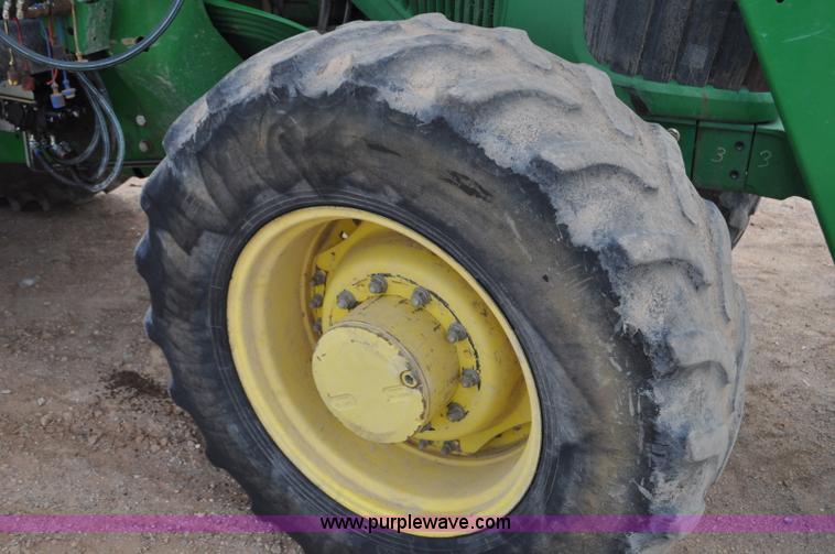 image for item F2024 2003 John Deere 7520 MFWD tractor